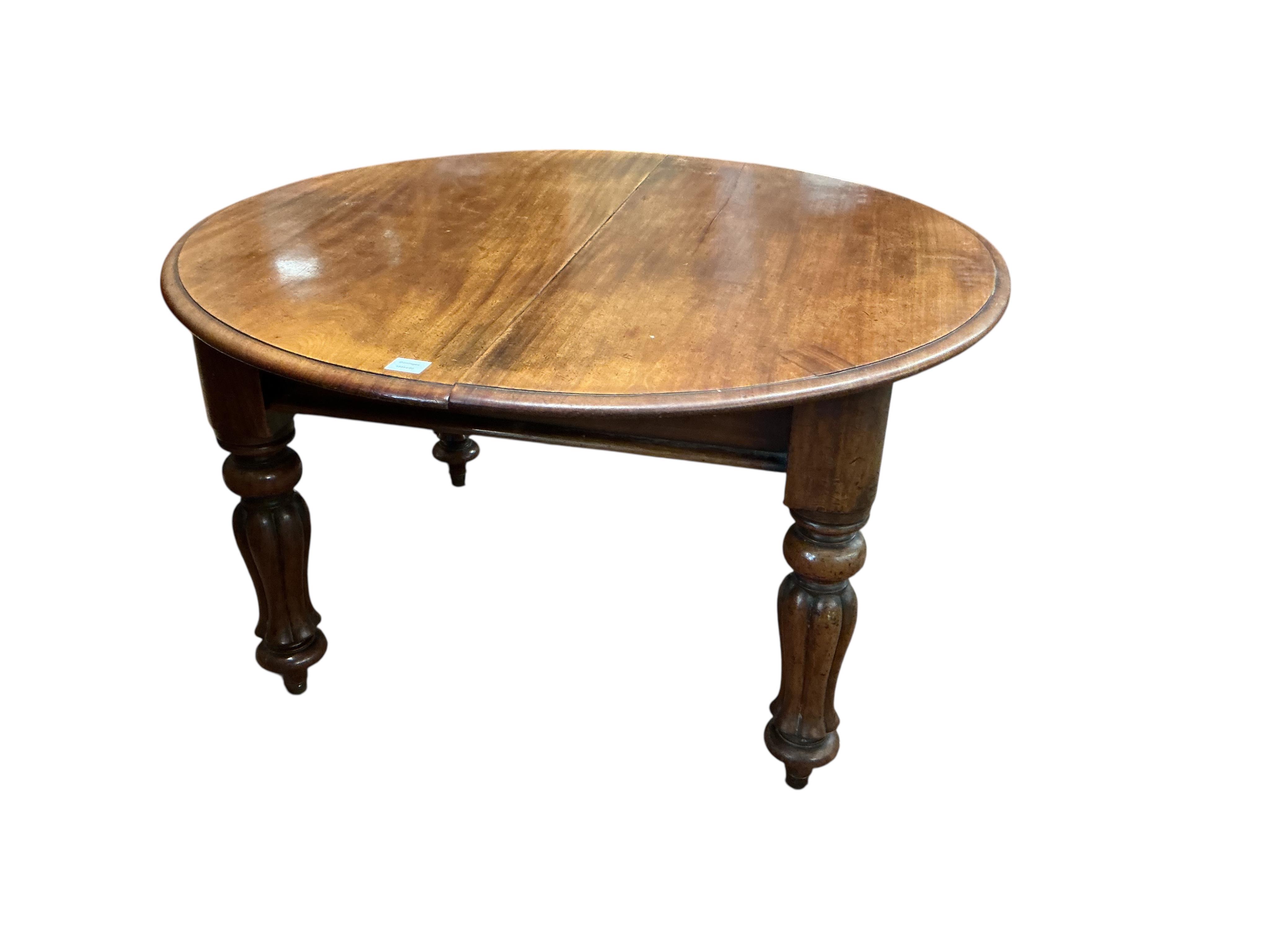 A Victorian mahogany extending dining table, 238cm extended, two spare leaves together with a harlequin set of six William IV mahogany dining chairs
